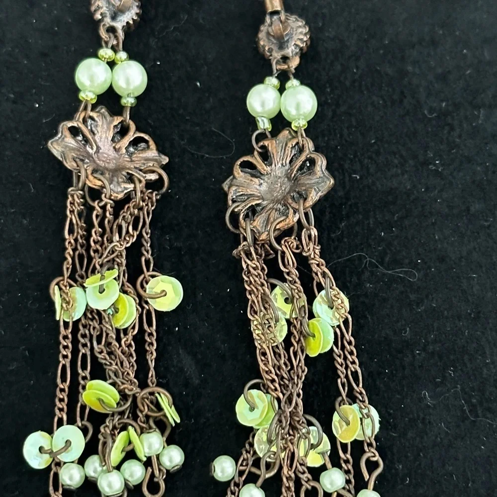 Pierced long dangling earrings of green and pink crystals and pearl like beads